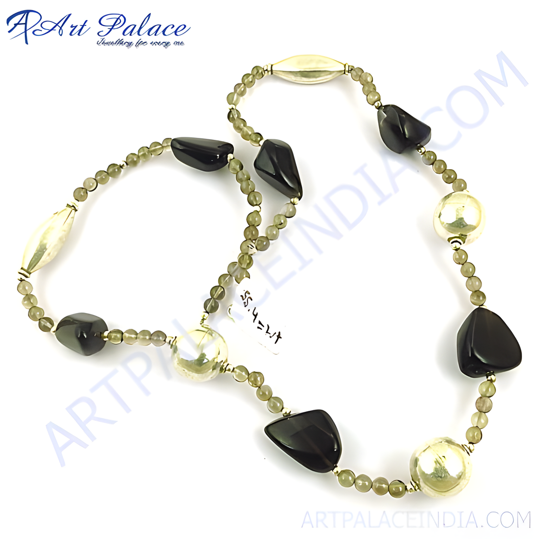 A stunning necklace featuring onyx and pearl beads on a white surface.