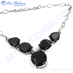 Load image into Gallery viewer, Silver necklace with teardrop-shaped black gemstones. Stylish pendant necklace on white background.
