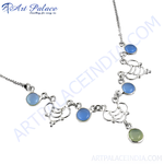 Load image into Gallery viewer, Sterling silver necklace with blue chalcedony gemstones. A delicate silver chain with unique design and a green stone at the end.
