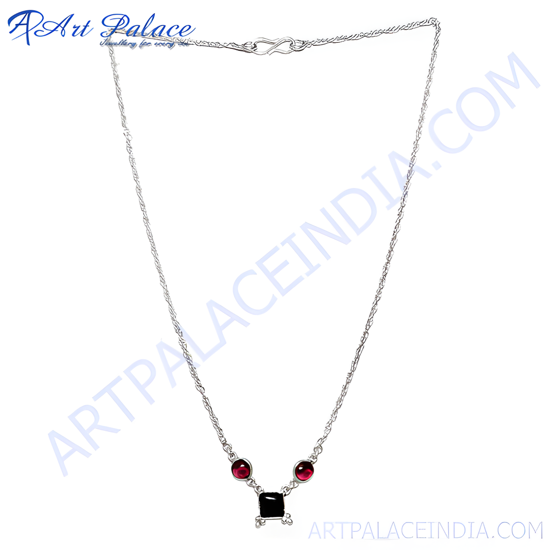 Sterling silver necklace with a black square center stone and red garnet accents
