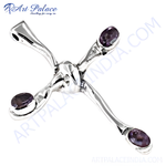 Load image into Gallery viewer, Silver cross pendant with four oval-shaped amethyst gemstones, showcasing a polished finish.
