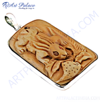 Load image into Gallery viewer, Rectangular pendant with carved bone rabbit design set in a silver border, detailed and artistic.
