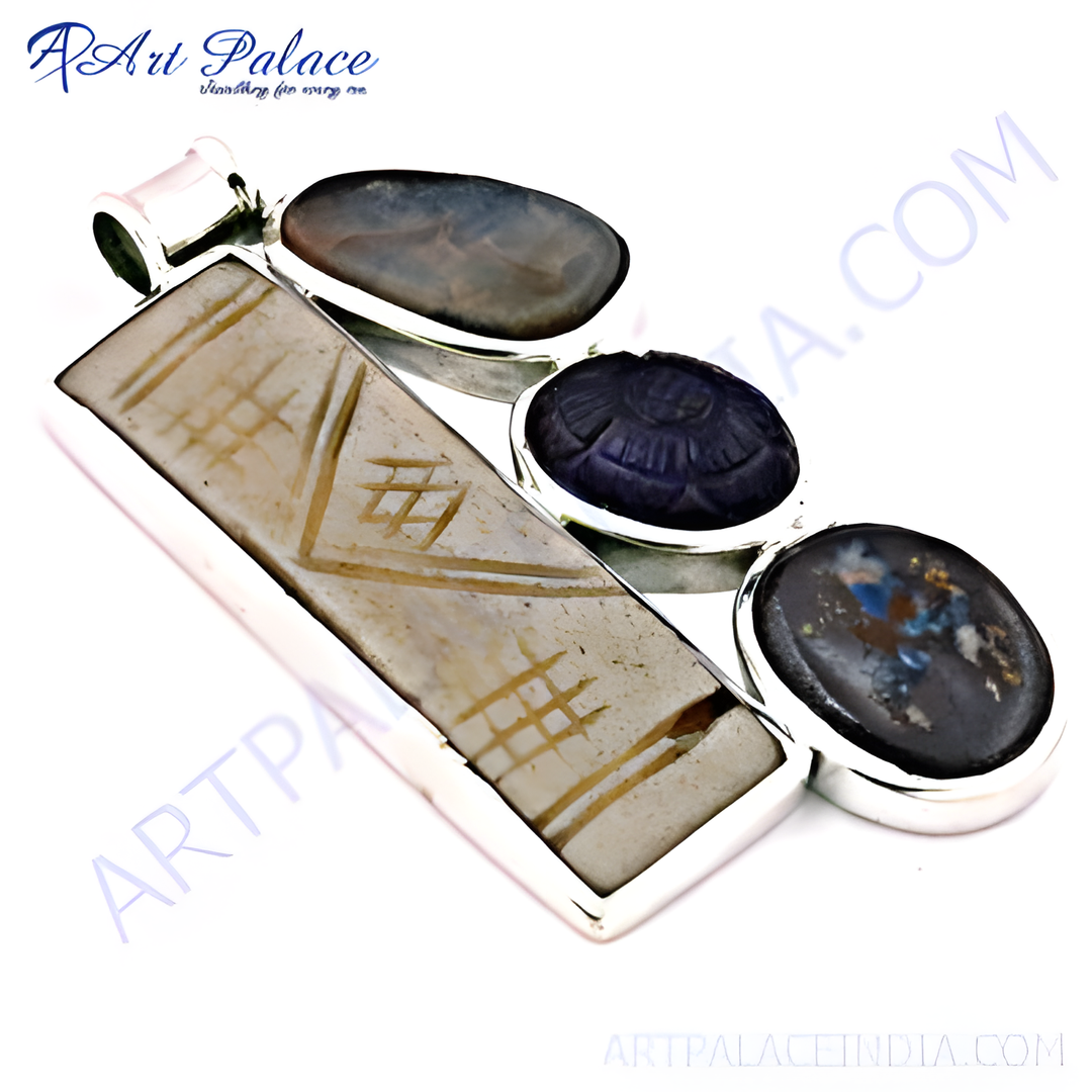 Sterling silver pendant with inlaid stones and intricate design. Features a rectangular central stone and oval side stones.