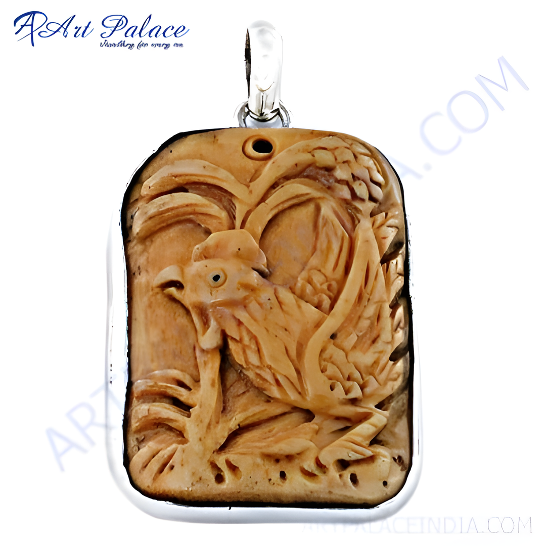 Carved rooster pendant with a silver frame, a detailed and unique animal jewelry piece.