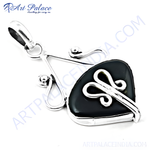 Load image into Gallery viewer, Sterling silver pendant with a black onyx gemstone. A modern and elegant necklace design.
