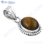Load image into Gallery viewer, 925 sterling silver pendant featuring an oval Tiger's Eye gemstone in brown and gold plating hues.

