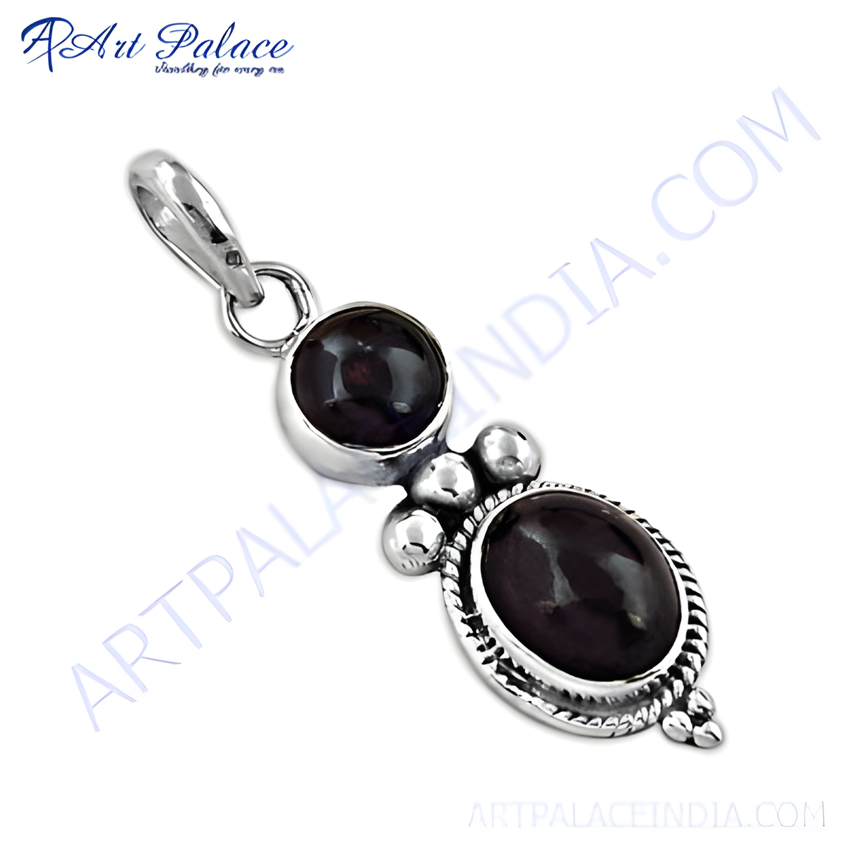 Sterling silver pendant featuring two oval and round dark red garnet gemstones set against a white background