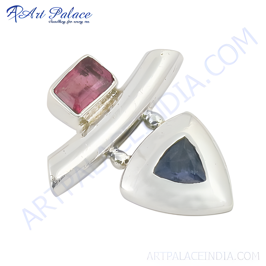 Sterling silver gemstone ring featuring a pink tourmaline and blue sapphire stones.