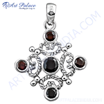 Load image into Gallery viewer, 925 sterling silver charm pendant with round-cut red garnet gemstones. This intricate design is perfect for gifting.
