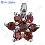 Load image into Gallery viewer, Sterling silver flower pendant with red garnet gemstones, a beautiful piece of gemstone jewelry
