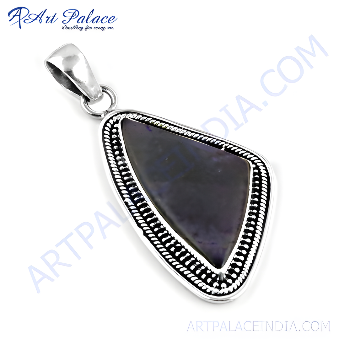 925 sterling silver pendant with a blue gemstone center for women, with intricate silver design and loop.