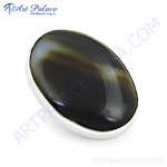 Load image into Gallery viewer, Sterling silver ring with a large, polished oval-shaped black onyx gemstone set against a white background.
