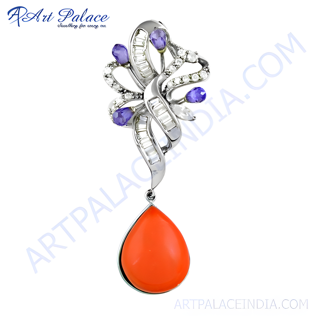 Silver pendant with orange coral teardrop and tanzanite accents, a beautiful gemstone jewelry piece.