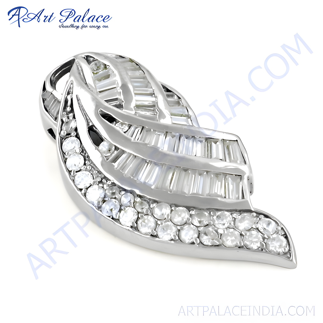 Silver pendant with baguette and round cut diamonds, a leaf-like design.