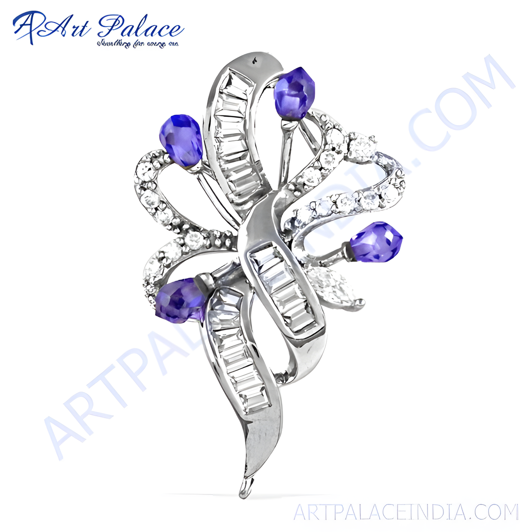 Silver brooch with tanzanite and diamond gemstones, a unique and elegant jewelry design.