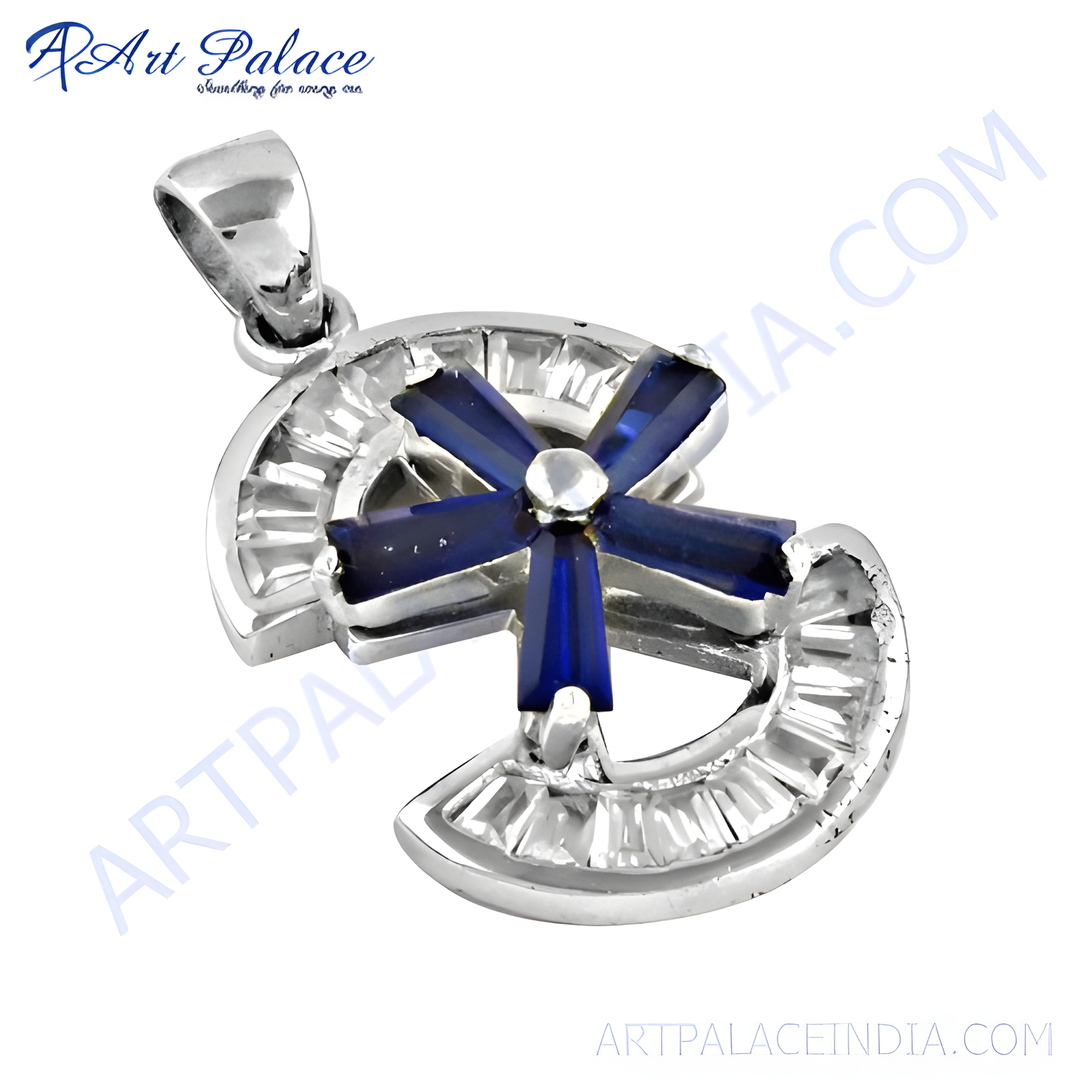 Sterling silver cross pendant with blue sapphire gemstone accents and baguette cut cubic zirconia