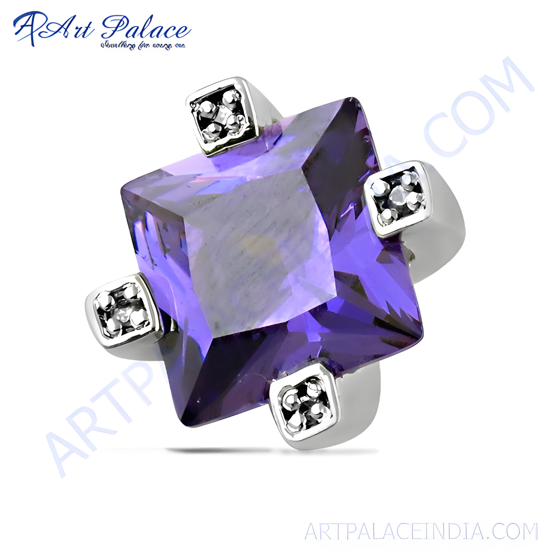 Sterling silver square amethyst ring with small accent stones. Featuring a large, vibrant purple gemstone.
