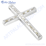 Load image into Gallery viewer, Sterling silver cross pendant necklace with baguette-cut cubic zirconia gemstones.
