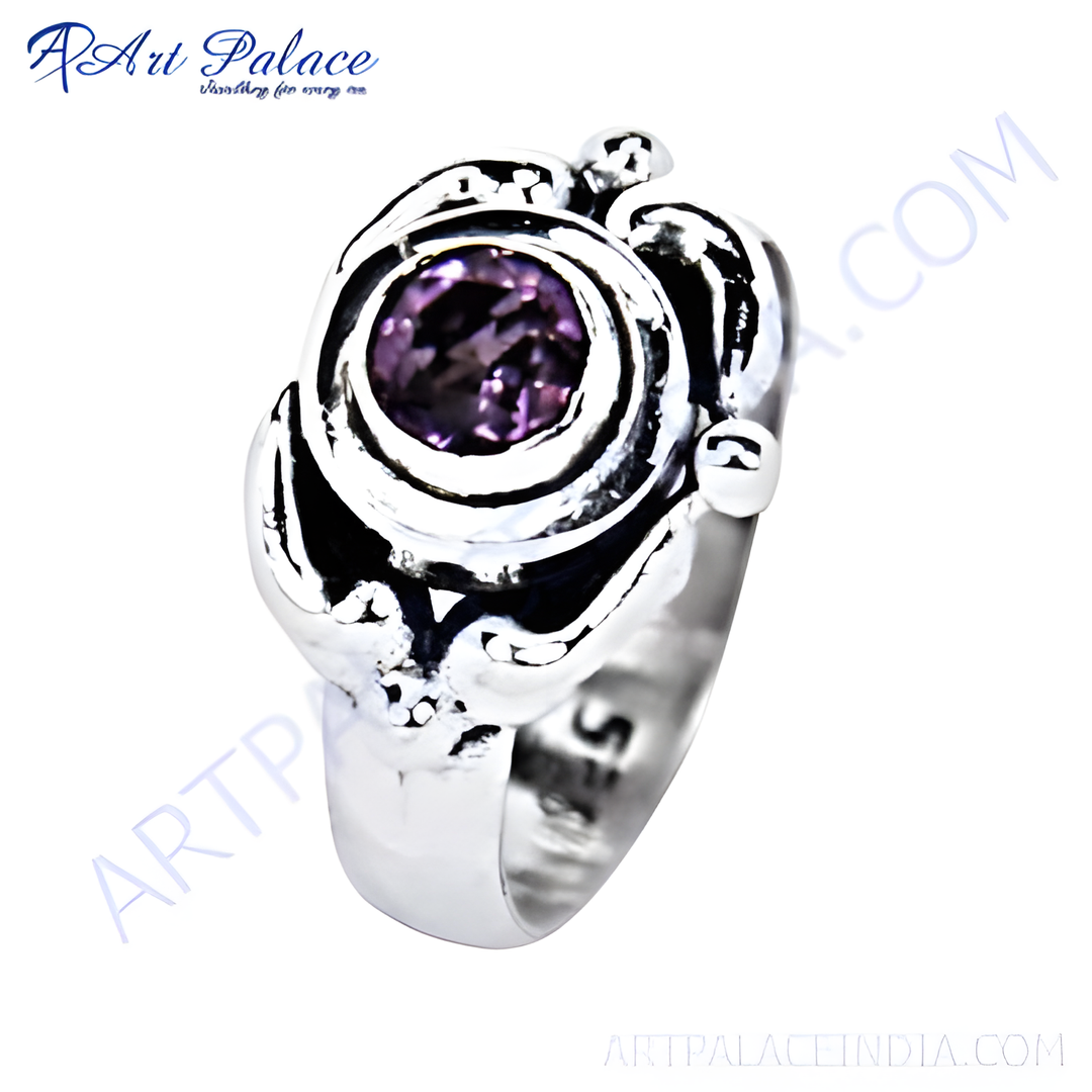 Sterling silver ring with a large round purple amethyst gemstone set in a unique design.