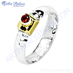 Load image into Gallery viewer, Sterling silver ring featuring a round red garnet gemstone with gold accents, a stunning piece of jewelry.
