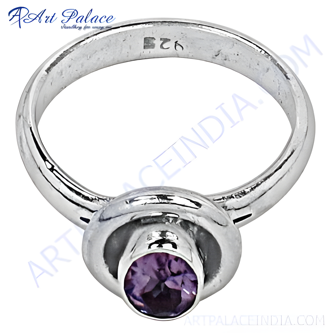 Sterling silver ring with round-cut purple amethyst gemstone. Simple elegant design.