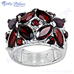 Load image into Gallery viewer, Sterling silver ring with multiple marquise-cut red garnet gemstones, a beautiful jewelry piece for women.
