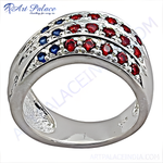 Load image into Gallery viewer, Sterling silver ring with alternating rows of red rubies and blue sapphires, showcasing a vibrant gemstone design.
