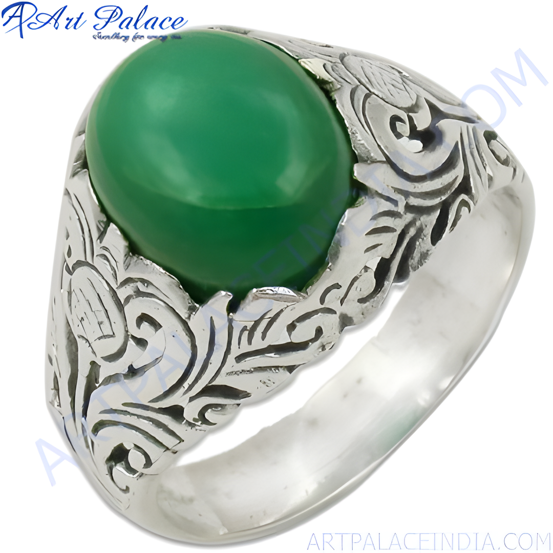 Sterling silver ring with a large oval green gemstone, intricate details on the band, perfect for men's fashion.
