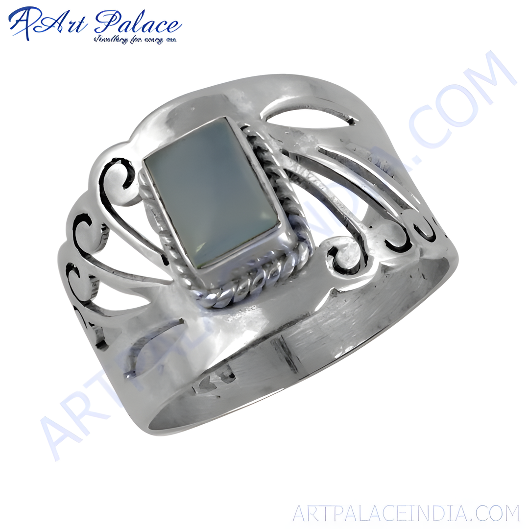 Sterling silver ring with a rectangular green gemstone. The ring has an openwork design.