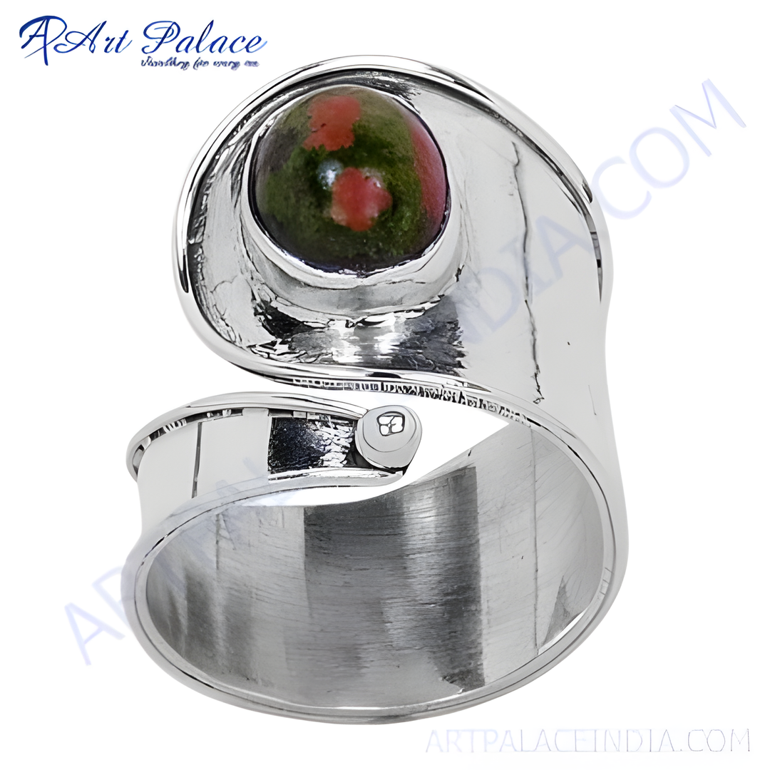 Sterling silver ring with a vibrant green and pink unakite stone, showcasing a unique design.