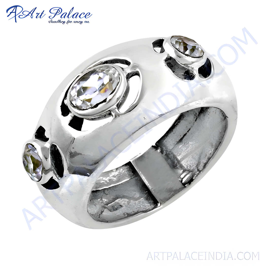 Sterling silver ring featuring a central oval cubic zirconia and smaller round stones.