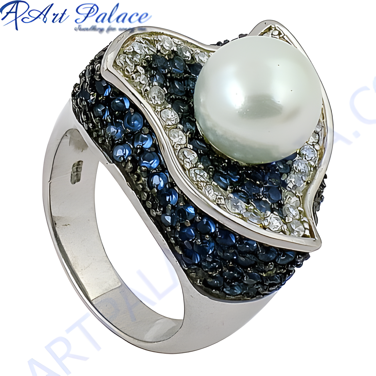 Sterling silver ring featuring a large white pearl and blue gemstone accents