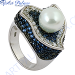 Load image into Gallery viewer, Sterling silver ring featuring a large white pearl and blue gemstone accents.
