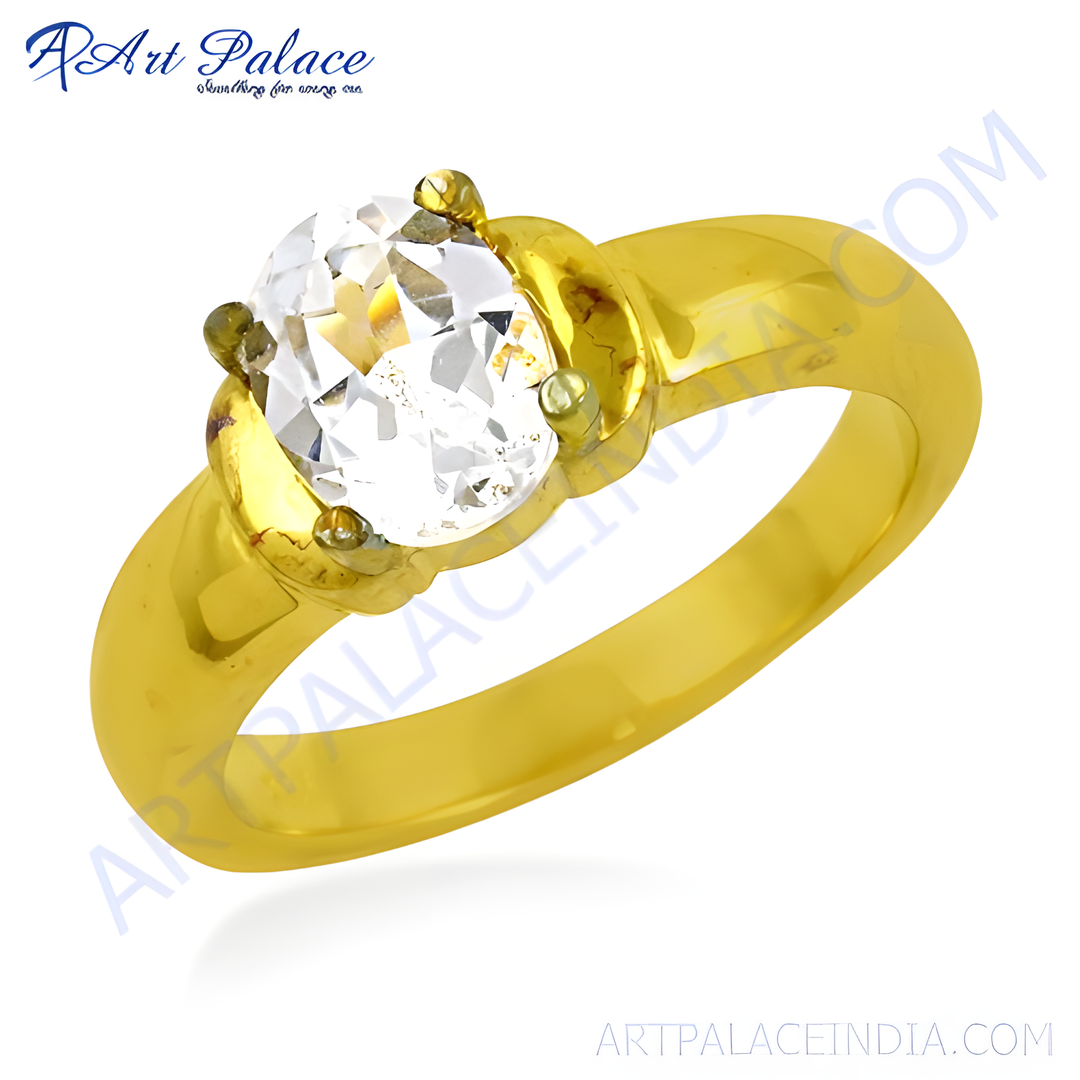 gold plating ring with a large, oval-cut white gemstone, showcasing a classic design.