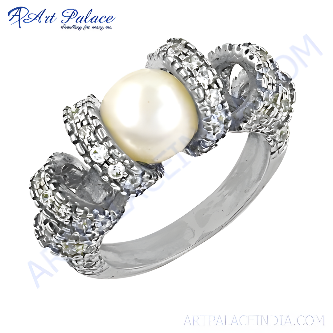 Sterling silver pearl ring with a large central pearl and cubic zirconia accents.