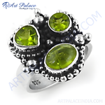 Load image into Gallery viewer, 925 sterling silver ring with three peridot gemstones.
