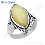 Load image into Gallery viewer, 925 sterling silver statement ring with a large oval cream colored gemstone.
