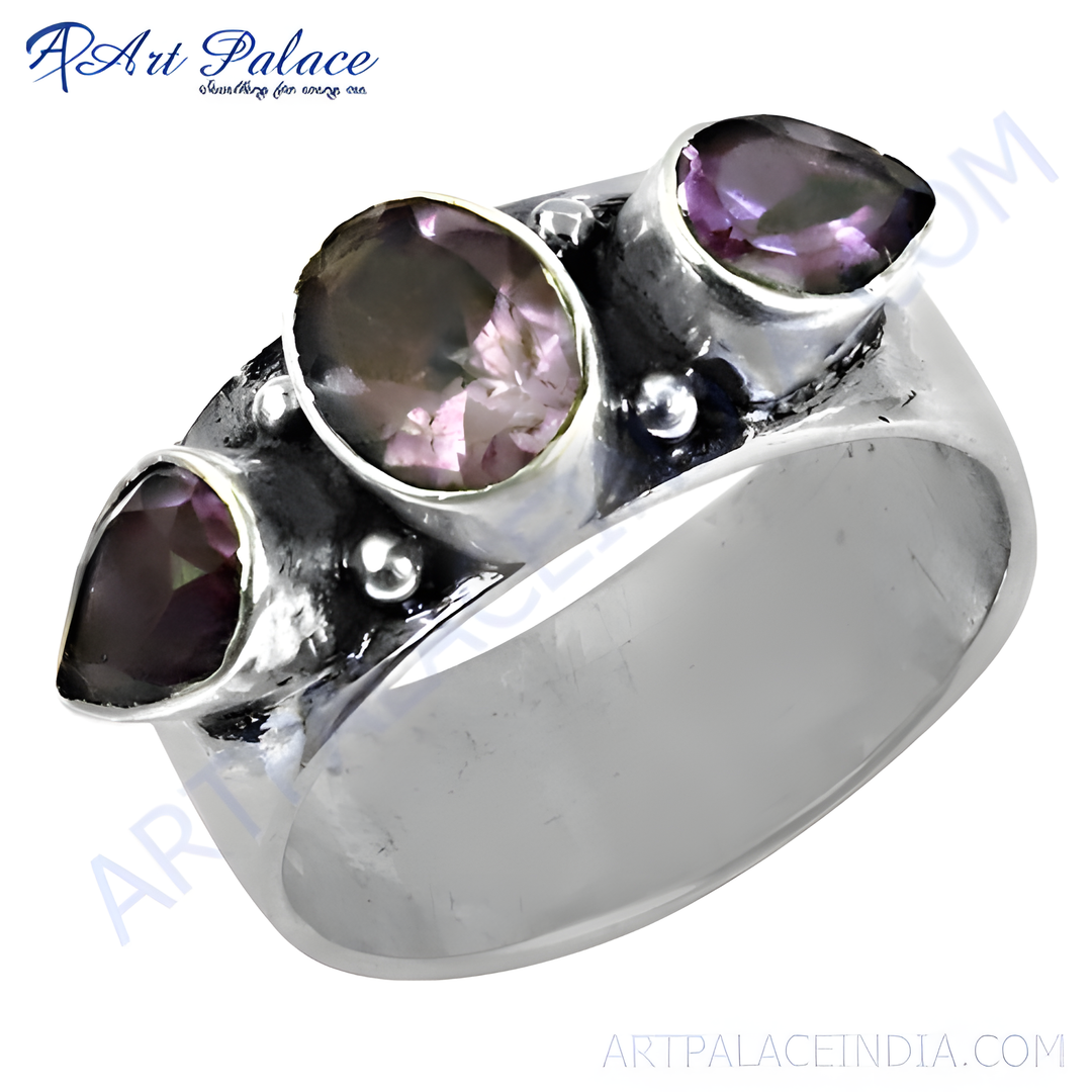 Sterling silver ring with three amethyst gemstones. Purple and silver ring.
