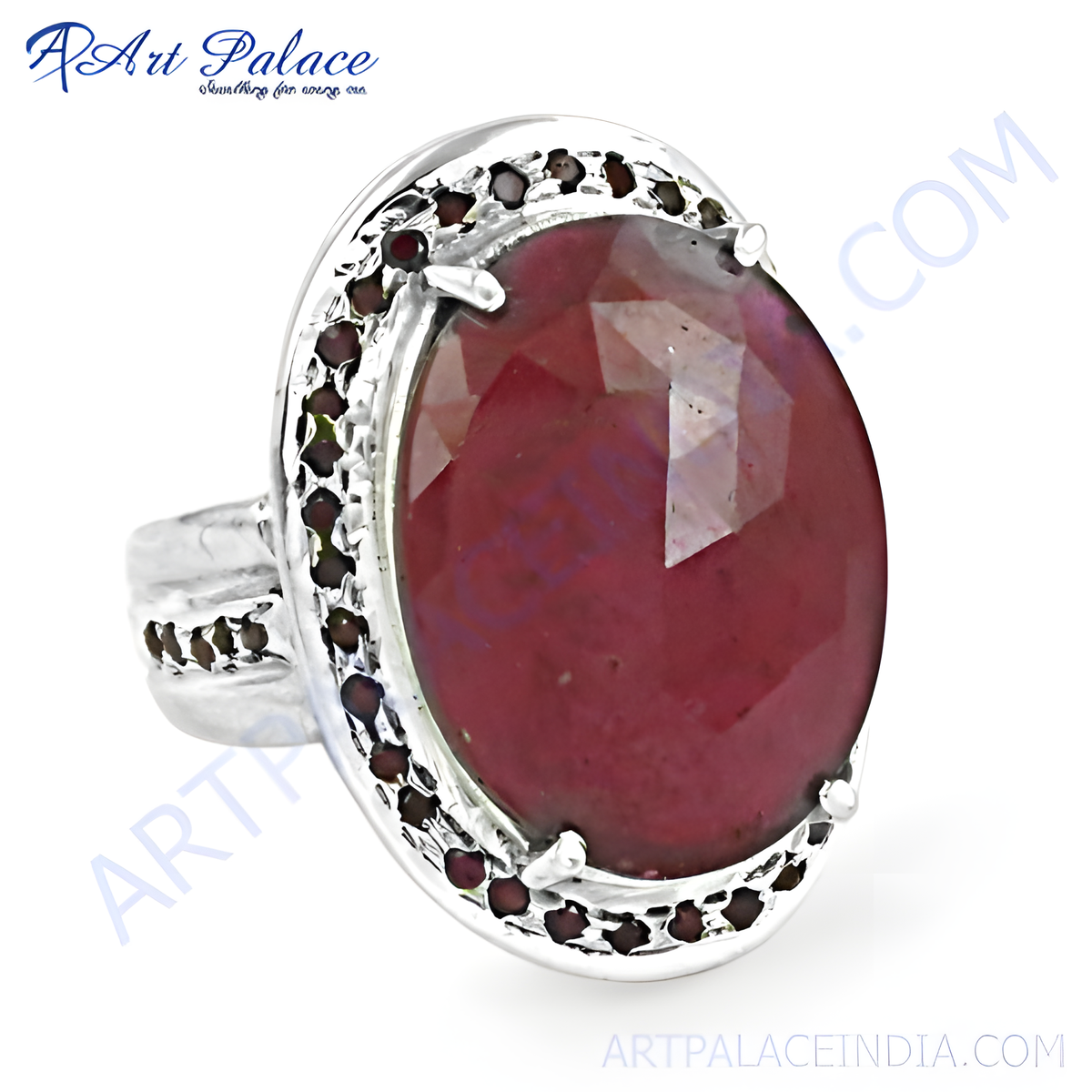 Sterling silver ring with a large oval cut red ruby gemstone and smaller gemstones around the perimeter