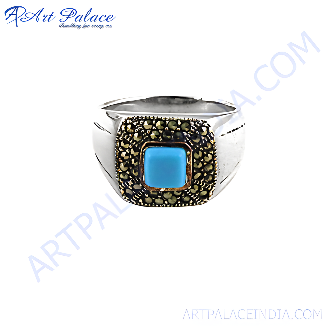 Sterling silver ring with a square turquoise gemstone center surrounded by marcasite stones.