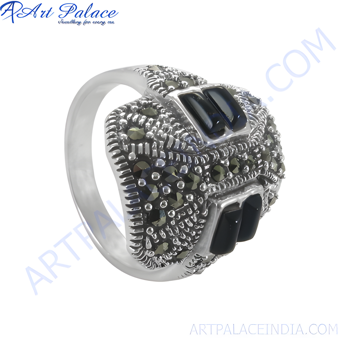 Sterling silver ring with intricate marcasite detailing and black onyx stones. Elegant and stylish design.