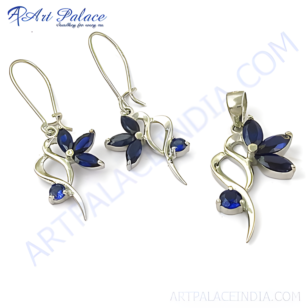 Sterling silver earring and pendant set with blue sapphire gemstones in a flower design.