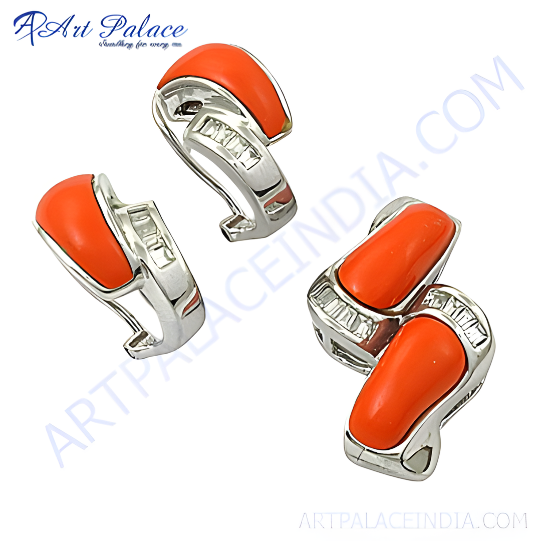Silver stud earrings with vibrant orange coral stones and sparkling cubic zirconia accents.