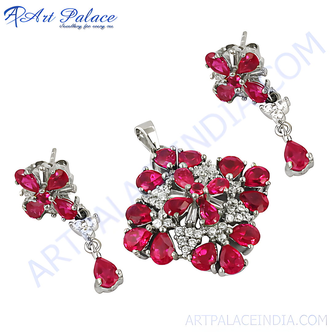 Silver pendant and matching ruby earrings set with red pear-shaped gemstones, ideal for women
