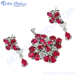 Load image into Gallery viewer, Silver pendant and matching ruby earrings set with red pear-shaped gemstones, ideal for women
