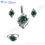 Load image into Gallery viewer, Sterling silver emerald jewelry set featuring a pendant, earrings, and ring with green gemstone centers.
