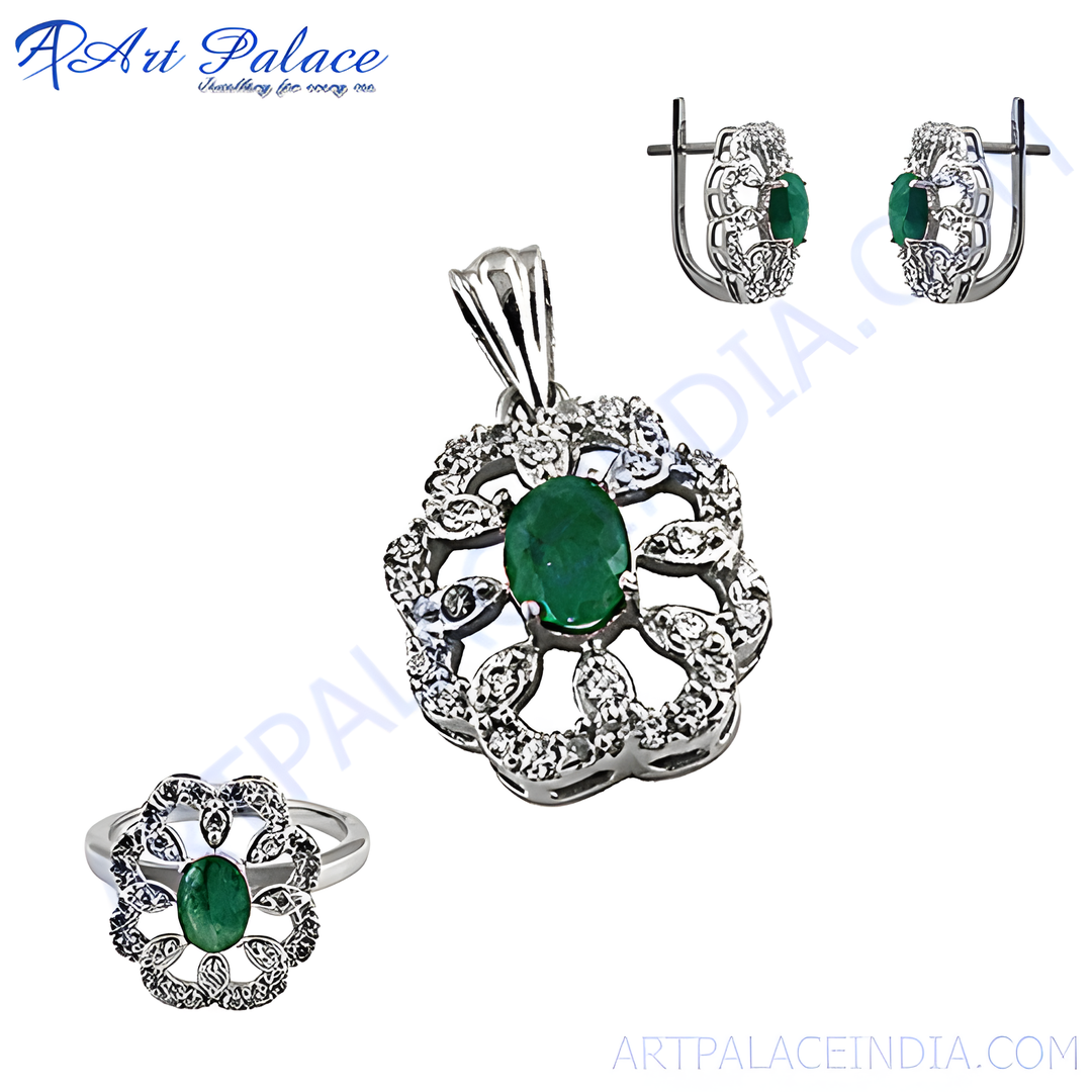 Sterling silver emerald jewelry set featuring a pendant, ring, and earrings with green emerald gemstones.