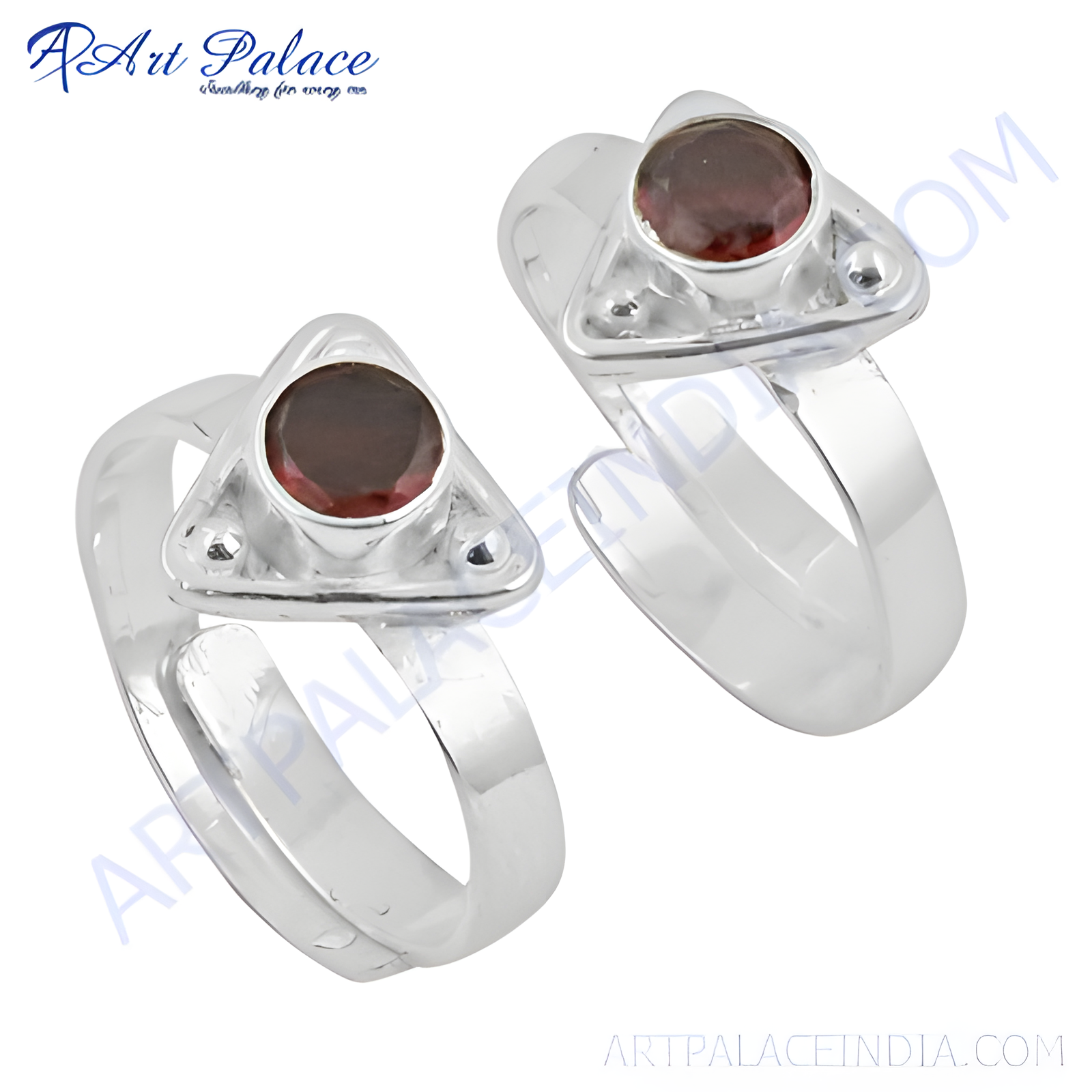 Sterling silver toe rings featuring a triangular design with a round, deep red garnet gemstone.