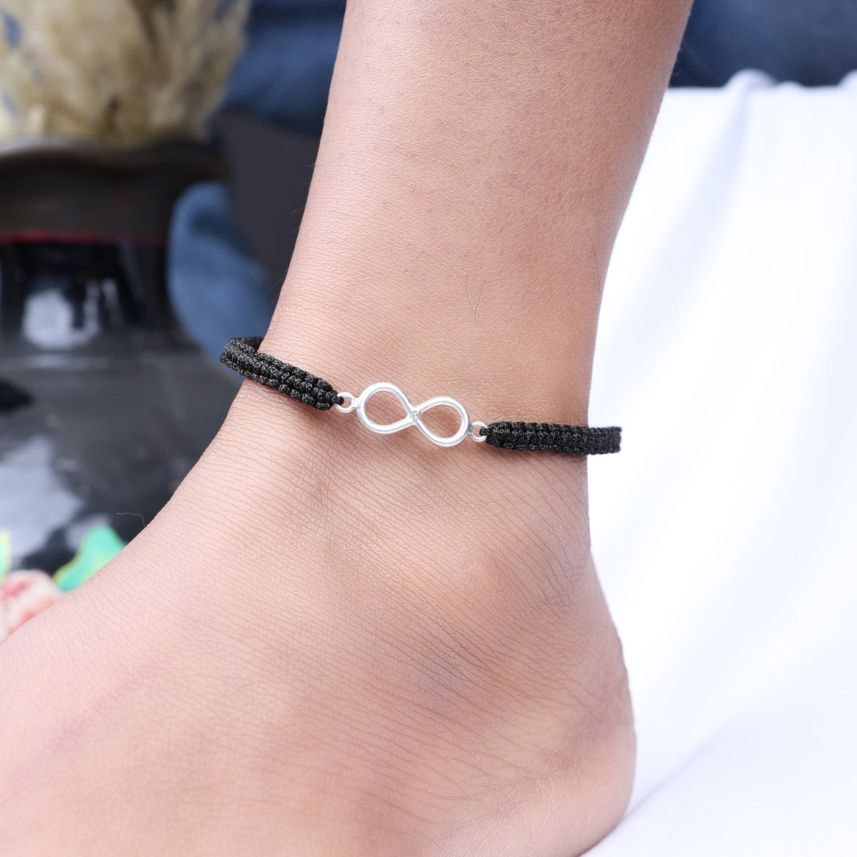 Black cord infinity bracelet with silver charm | adjustable