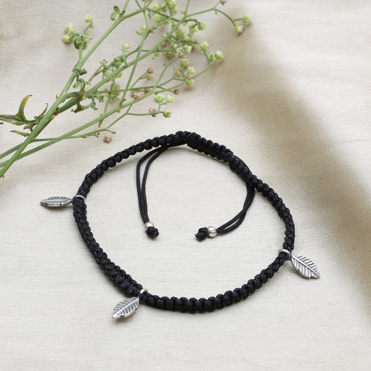 Black macrame cord bracelet with silver leaf charms | adjustable